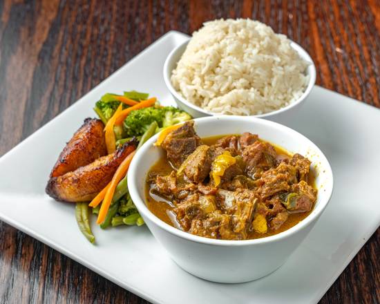 Order Breezes Curry Goat food online from Breezes Island Grill store, New York on bringmethat.com