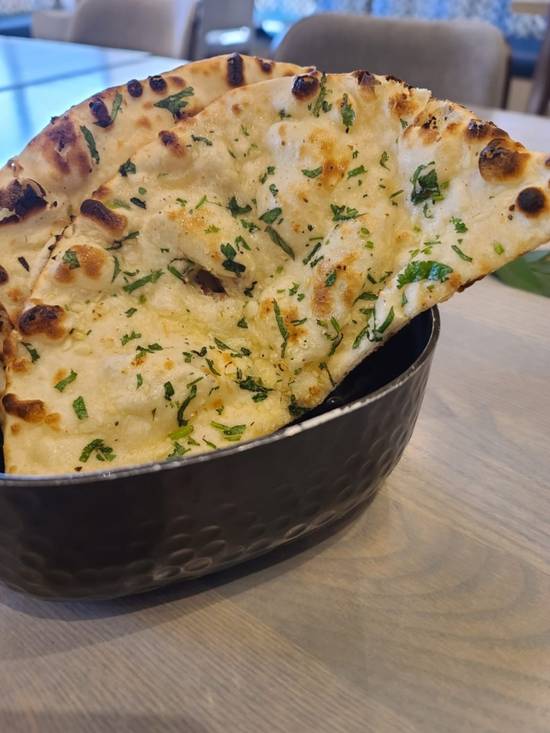 Order Garlic Naan food online from Raag Indian Cuisine store, Minneapolis on bringmethat.com