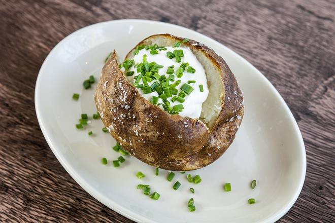 Order Idaho Baked Potato food online from Wood Ranch BBQ & Grill store, Rancho Santa Margarita on bringmethat.com