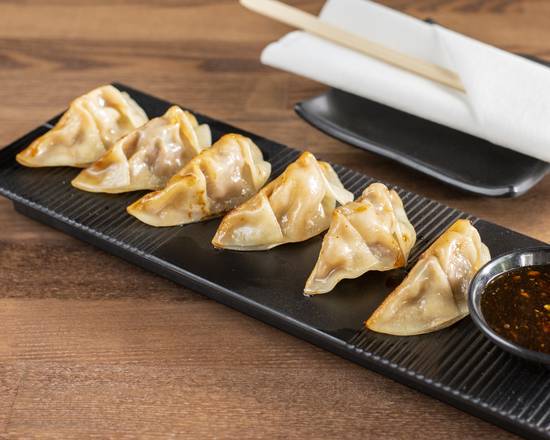 Order Pan-Fried Dumplings (8 Pieces) food online from CY Chinese Restaurant Szechuan Cuisine store, North Miami Beach on bringmethat.com