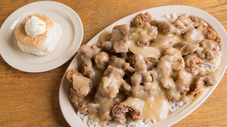 Order 11. Giblets, Rice with Gravy & Onions food online from Roscoe House Of Chicken & Waffles store, Long Beach on bringmethat.com