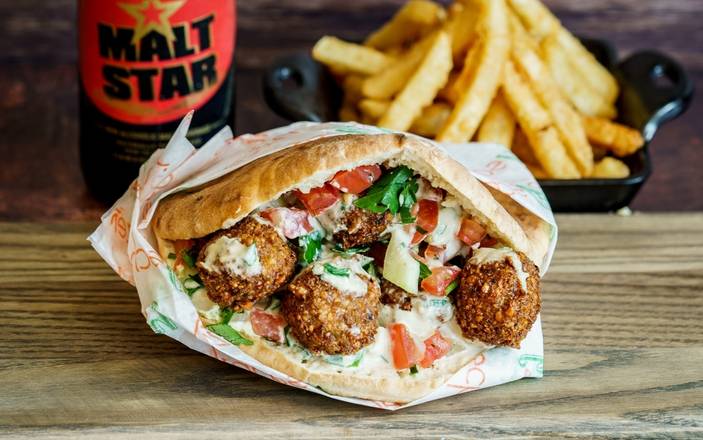 Order Falafel in a Pita food online from Holy Schnitzel store, Aventura on bringmethat.com