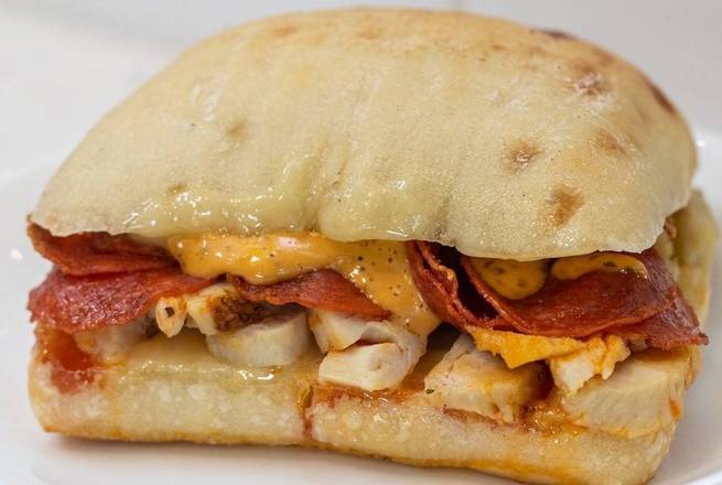 Order Pepperoni Chicken Ciabatta Sandwich food online from Einstein Bros Bagels store, Palm Harbor on bringmethat.com