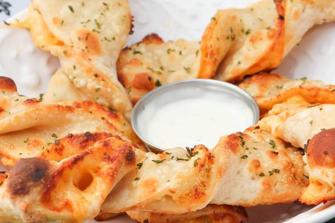 Order Garlic-Parm Twists food online from Noahs Pizza store, Sacramento on bringmethat.com
