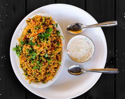 Order Veggie Pulao food online from Art of Biryani store, Ocean on bringmethat.com