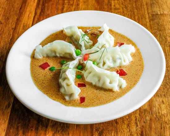 Order Steamed Dumpling with Curry Sauce food online from Summer Summer Thai Eatery store, Emeryville on bringmethat.com