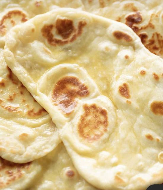 Order Plain Naan food online from Tabla Indian Cuisine store, Orlando on bringmethat.com