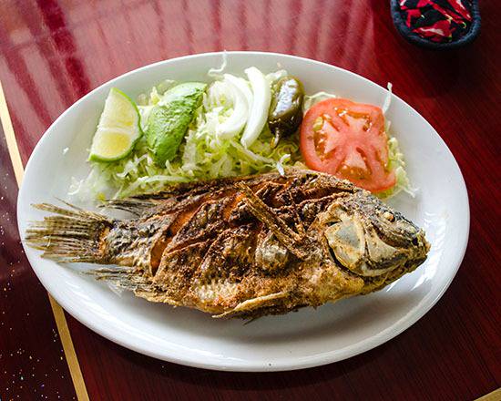Order Mojarra Frita food online from El Guerrero Mexican Grill store, Pinellas Park on bringmethat.com