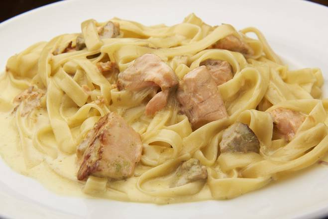 Order Salmon Fettuccine food online from Sunflower Cafe store, Lawrence on bringmethat.com