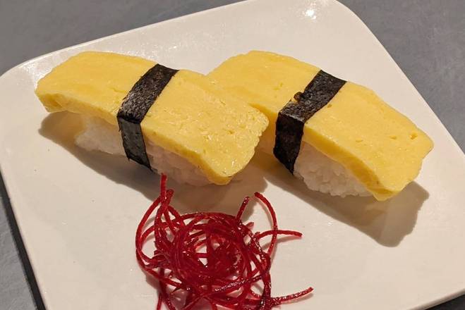 Order Tamago (Egg Omelette) Nigiri food online from Jojo Sushi Bar & Restaurant store, Santa Rosa on bringmethat.com