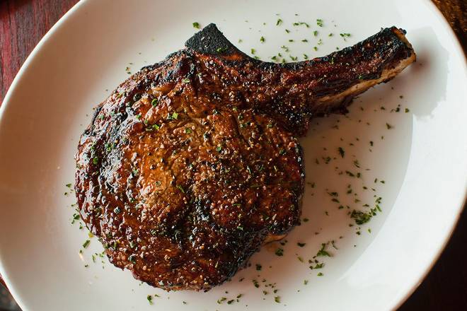 Order BONE-IN RIBEYE food online from Sullivan's store, Palm Desert on bringmethat.com
