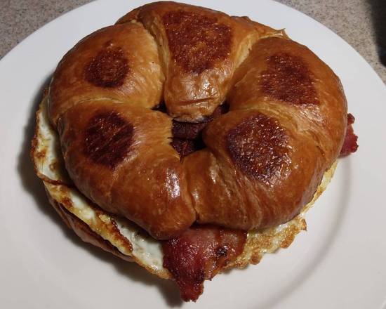 Order Bacon, Egg, Cheese, and Croissant Sandwich food online from Jans Cafe store, Greenacres on bringmethat.com