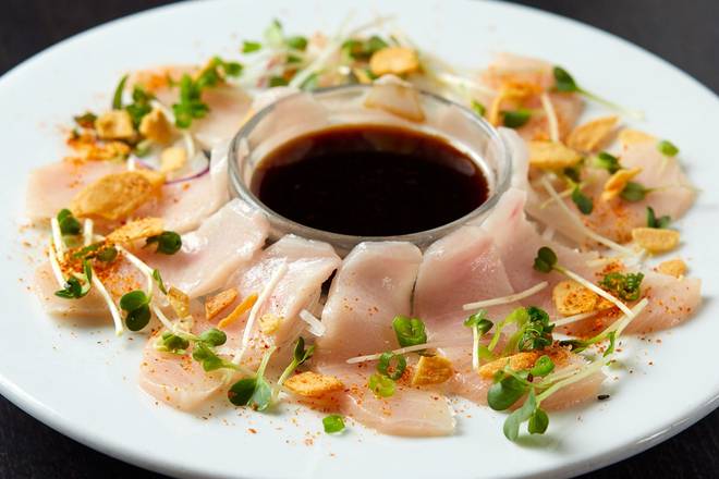 Order GARLIC PONZU YELLOWTAIL* food online from RA Sushi Bar store, Las Vegas on bringmethat.com