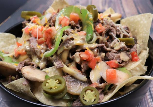 Order STEAK NACHO food online from Pepperjax Grill store, Grand Island on bringmethat.com