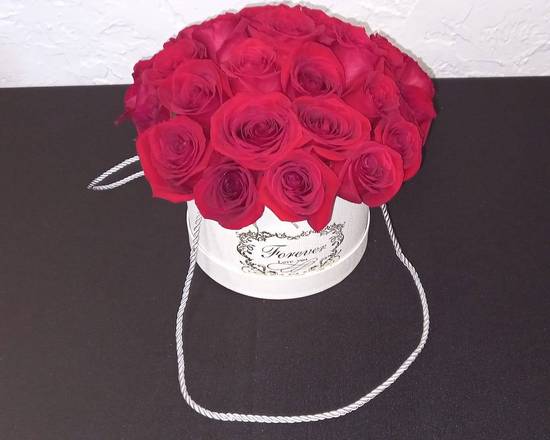 Order Red Roses in White Bucket food online from Claudia's Flowers store, North Miami on bringmethat.com