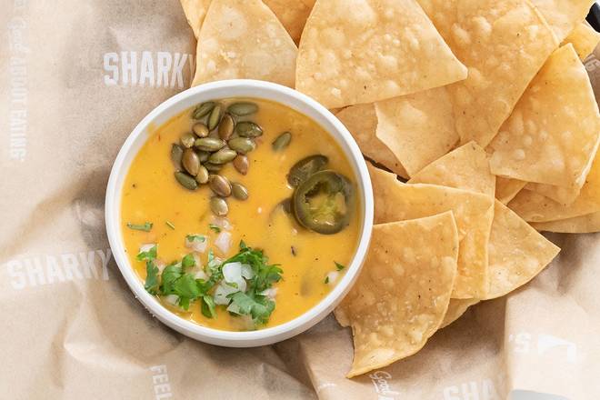 Order Plant Based Queso & Chips food online from Sharky's Woodfired Mexican Grill store, Los Angeles on bringmethat.com