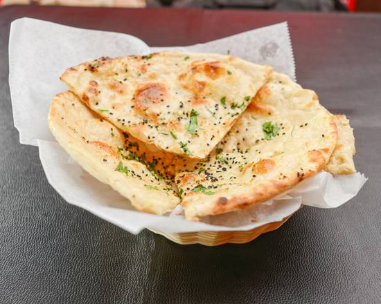 Order Garlic Naan food online from House Of India Pa store, Limerick on bringmethat.com