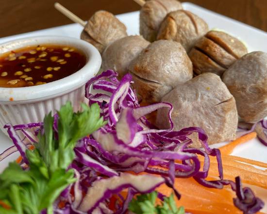 Order Grilled Meat Ball (ลูกชิ้นปิ้ง) food online from Charm Thai Restaurant store, Silver Spring on bringmethat.com