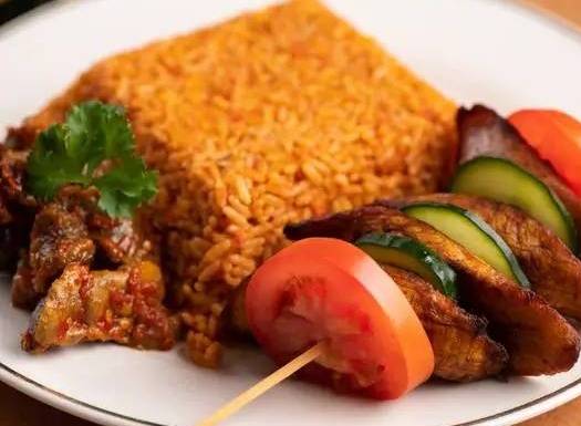 Order Jollof Rice food online from Wazobia Kitchen store, Houston on bringmethat.com