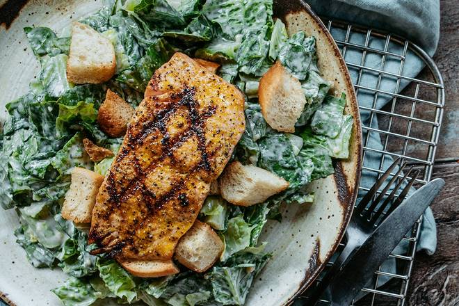 Order Mesquite-Grilled Salmon Caesar food online from Logan's Roadhouse store, Fayetteville on bringmethat.com