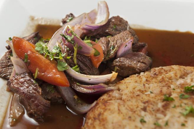 Order Tacu Tacu Con Lomo Saltado de Filet Mignon food online from Machupicchu Peruvian Cuisine Restaurant store, Miami on bringmethat.com