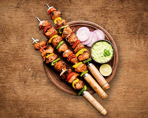 Order Charred Chicken Tikka food online from United Kitchens Of India store, Schaumburg on bringmethat.com