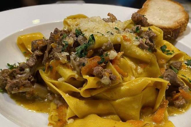 Order Pappardelle Tuscan Ragu' food online from Caffe Di Mauro store, Miami Beach on bringmethat.com