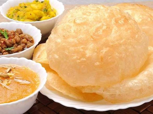 Order Halwa Poori (2 poori & Halwa) food online from Hadi Restaurant store, New York on bringmethat.com