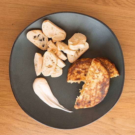Order Pincho de tortilla food online from Rodilla Sandwiches. Madrid 1939 store, Miami on bringmethat.com