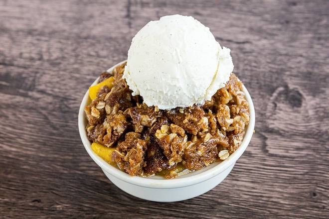 Order Mom's Deep Dish Peach Crisp food online from Wood Ranch BBQ & Grill store, Rancho Santa Margarita on bringmethat.com
