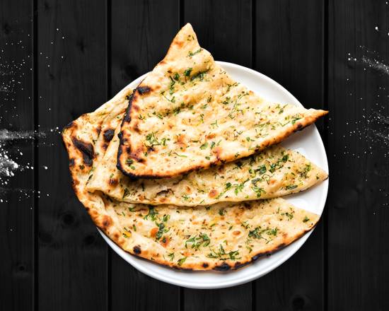 Order Garlic Naan food online from Art of Biryani store, Ocean on bringmethat.com
