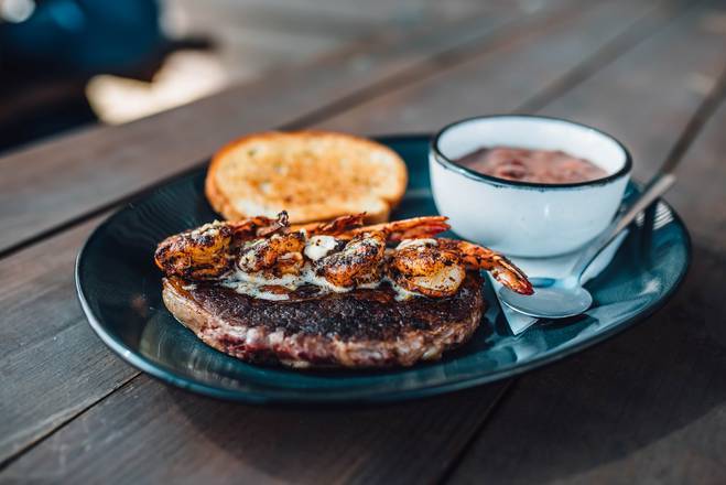 Order Cajun Ribeye with Blackened Jumbo Shrimp food online from Walk-On Sports Bistreaux store, Tallahassee on bringmethat.com