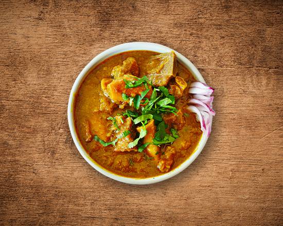 Order United Goat Curry food online from United Kitchens Of India store, Schaumburg on bringmethat.com