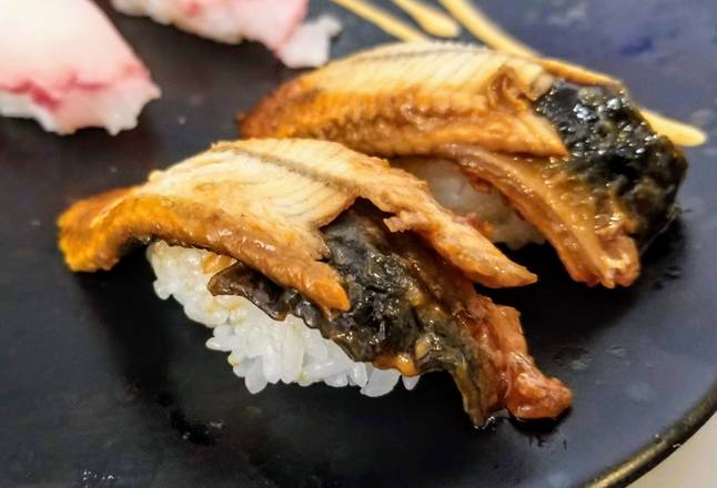Order Unagi (eel fish) Sushi Nigiri 2pcs food online from Koko's store, Dupont on bringmethat.com