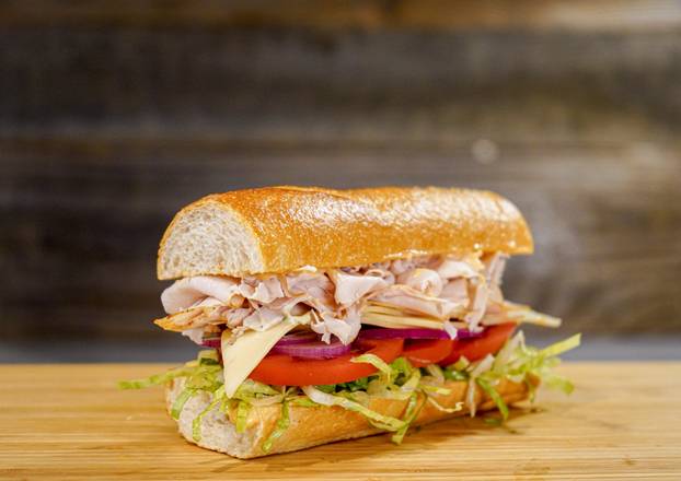 Order Garlic Pesto Turkey Sandwich  food online from Sourdough & Co. store, West Sacramento on bringmethat.com