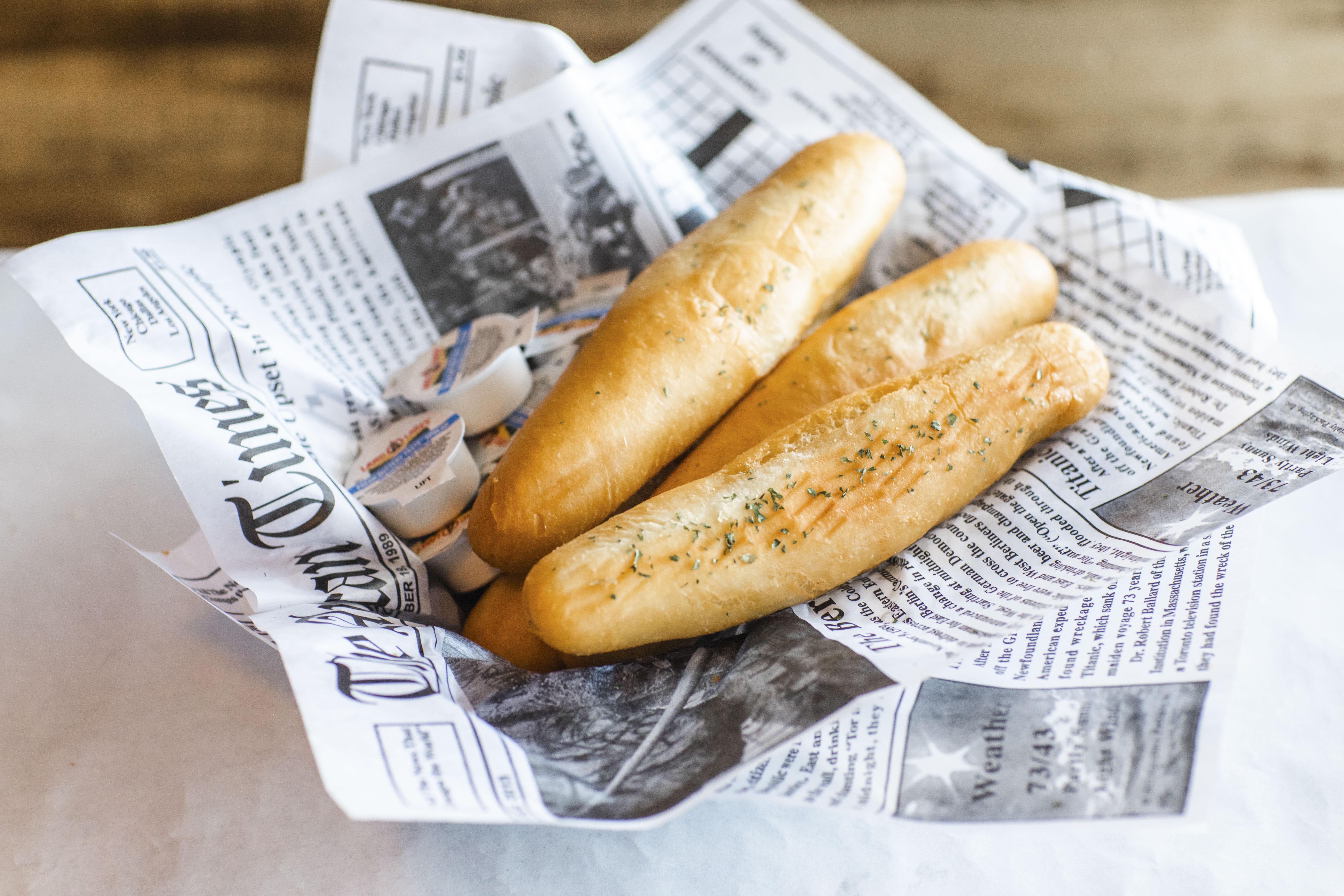 Order Garlic Breadsticks food online from Hook & Reel Cajun Seafood store, lubbock on bringmethat.com