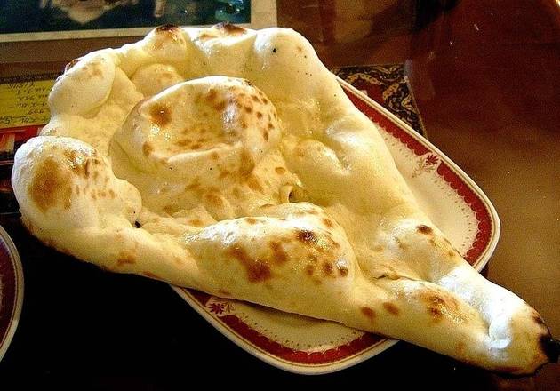 Order Butter Naan food online from Tikka Island store, San Antonio on bringmethat.com