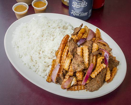 Order Lomo (Beef) Saltado with White Rice food online from Kikiriki Restaurant store, West New York on bringmethat.com