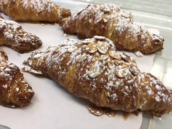 Order Almond Croissant food online from Crepes & Croissants store, Columbia on bringmethat.com