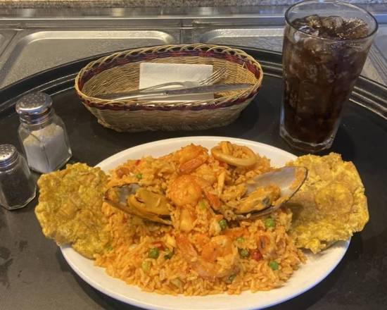 Order Paella with seafood - Paella con Mariscos + 1 Coca Cola Gratis food online from Medellin Restaurant store, Coconut Creek on bringmethat.com