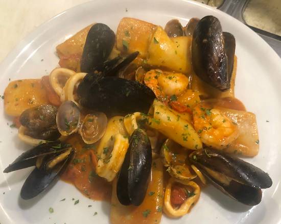Order "Frutti di Mare" Seafood Paccheri food online from Caffe Di Mauro store, Miami Beach on bringmethat.com