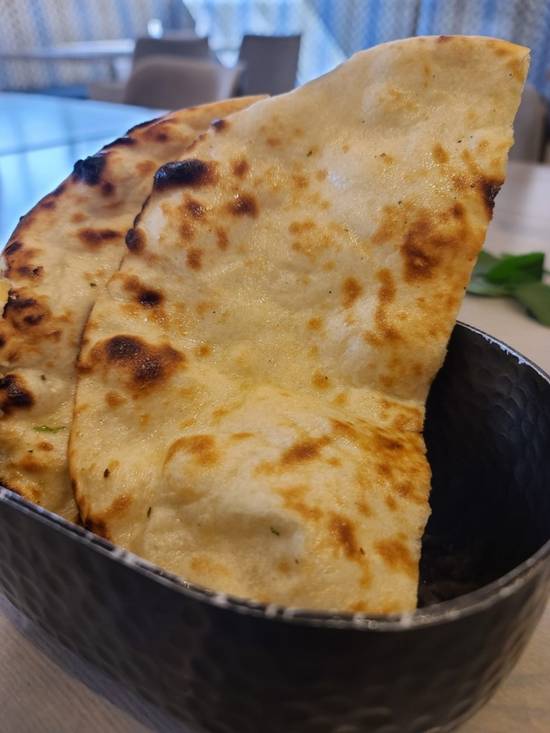 Order Butter Naan food online from Raag Indian Cuisine store, Minneapolis on bringmethat.com