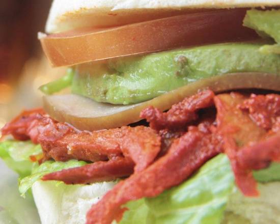 Order Torta de Pastor  food online from Chihua Restaurant & Bar store, El Paso on bringmethat.com