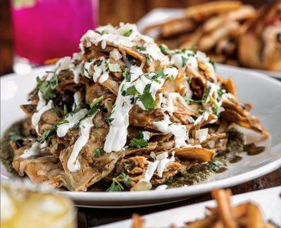 Order Nachos* food online from Coastal Kitchen & Daiquiri Bar store, Bay Shore on bringmethat.com