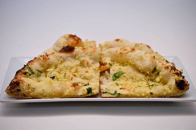 Order Garlic Naan food online from Ahmed Indian Grill And Restaurant store, Orlando on bringmethat.com