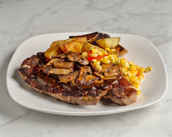 Order Hand-Cut Rib-Eye (14 oz) food online from Reign Restaurant store, Saint Louis on bringmethat.com