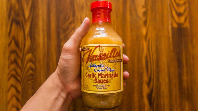Order Mojo de Ajo (Garlic Sauce Small Cup) food online from Versailles store, Encino on bringmethat.com
