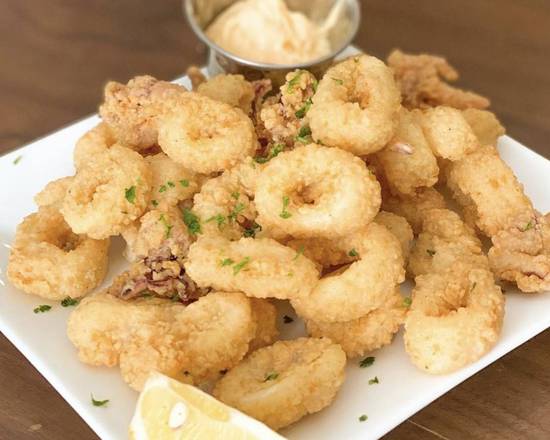 Order Fried Calamari food online from H&H Brazilian Steakhouse store, Los Angeles on bringmethat.com