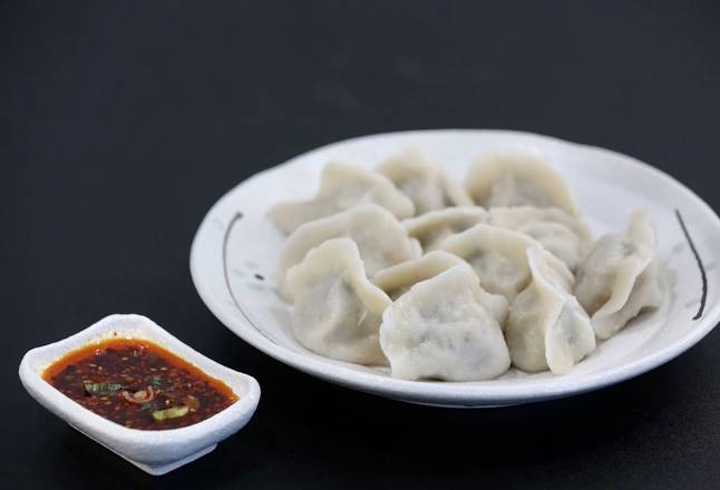 Order G2. Pork and Leek Handmade Dumplings (12 pcs) (猪肉韭菜馅手工水饺) food online from Yu Noodle store, Cupertino on bringmethat.com