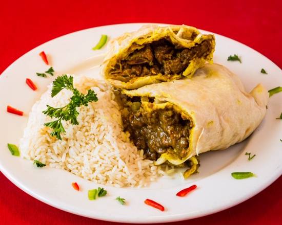 Order Curry Goat Roti food online from Jerk Pit Tampa store, Tampa on bringmethat.com